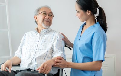 Happy Positive Asian Nurse Giving Support And Touching Contented